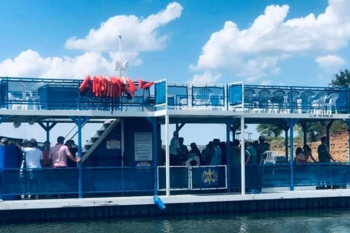 a boat is docked next to a body of water