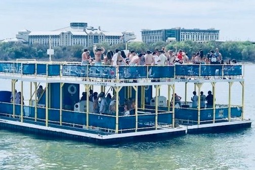 a group of people on a boat in the water