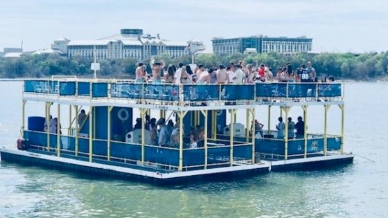 a group of people on a boat in the water