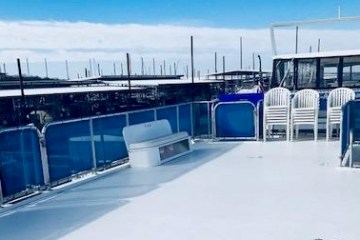 a train is parked on the side of the road