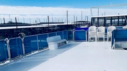 a train is parked on the side of the road