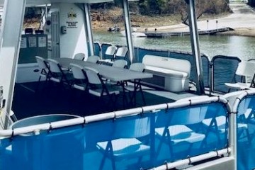 a blue and white boat in the water