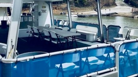 a blue and white boat in the water