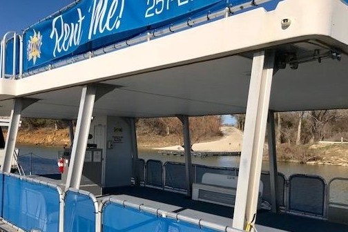 a blue and white train at a train station
