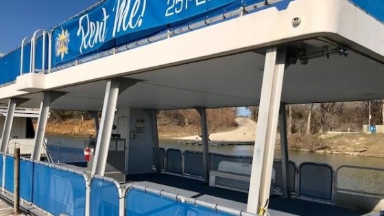 a blue and white train at a train station