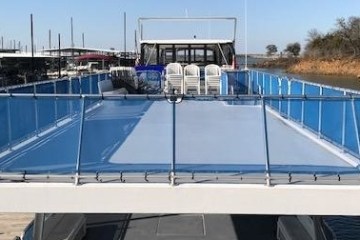 a blue and white boat parked at a dock