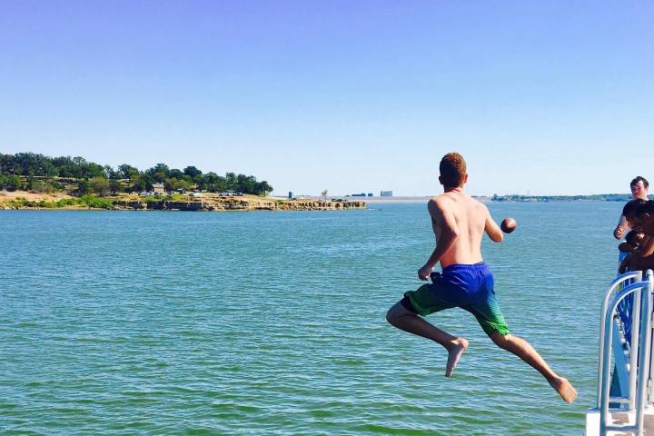 a man riding a board on a body of water
