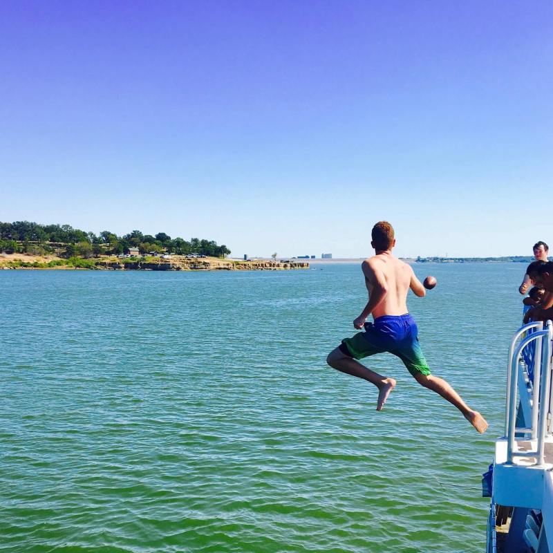 a man riding a board on a body of water