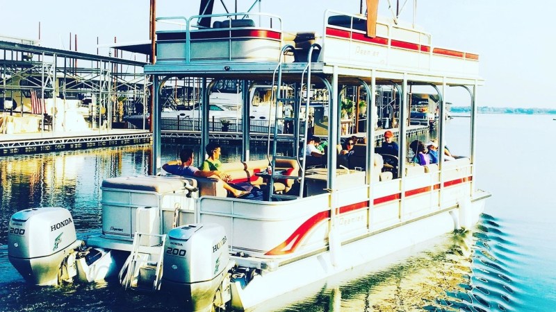 a boat is docked next to a body of water