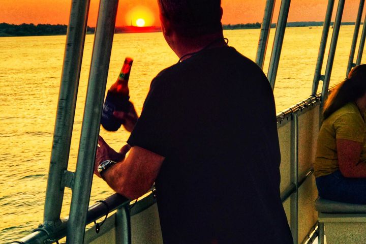 a man standing in front of a pier