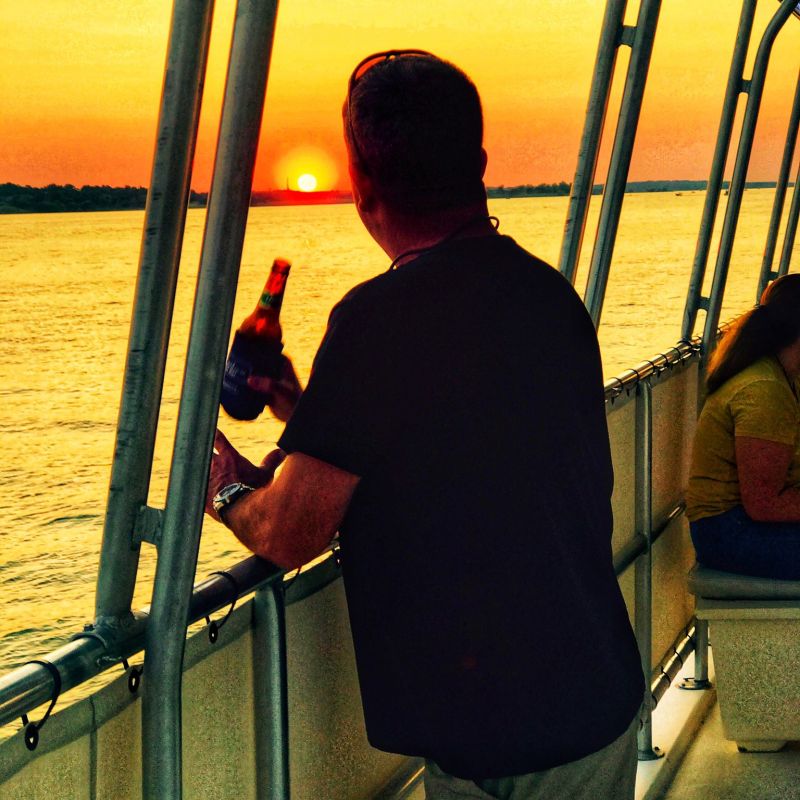 a man standing in front of a pier