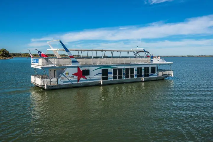 a boat is docked next to a body of water