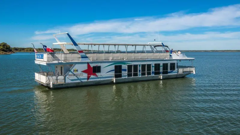 a boat is docked next to a body of water