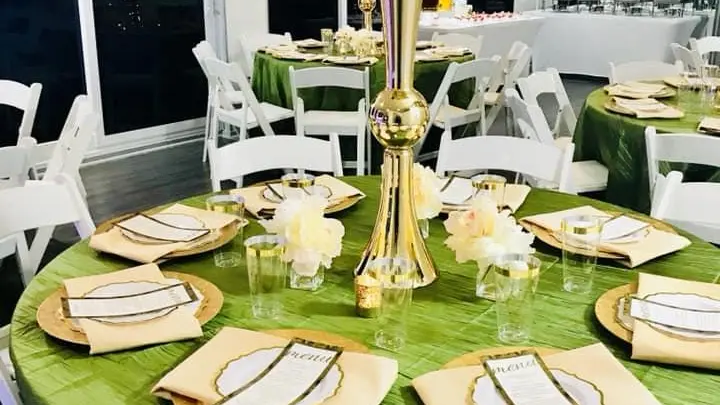 a group of people sitting at a dinner table