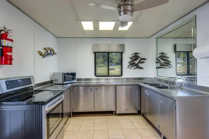 a large kitchen with stainless steel appliances