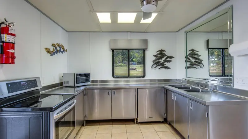 a large kitchen with stainless steel appliances