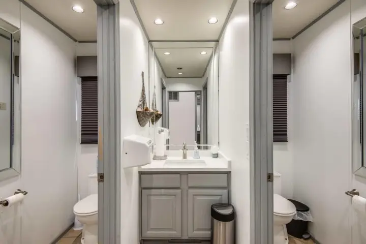 a room with a sink and a mirror