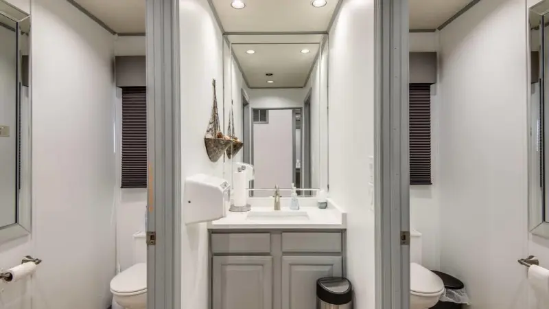 a room with a sink and a mirror