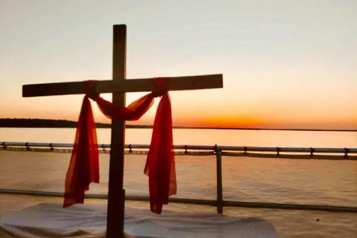 a close up of a pier next to a body of water