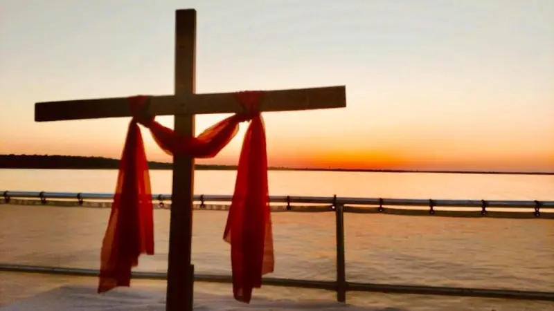 a close up of a pier next to a body of water
