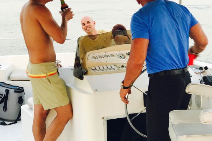 a couple of people that are standing in the water