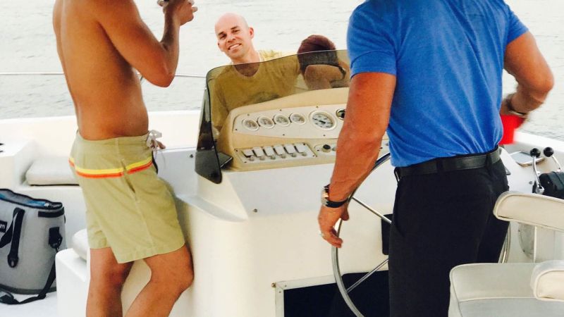 a couple of people that are standing in the water