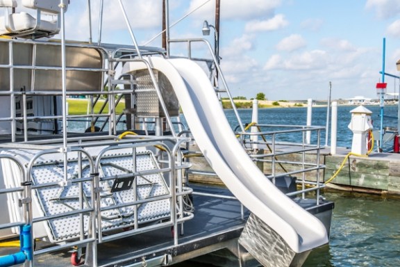 a boat is docked next to a body of water
