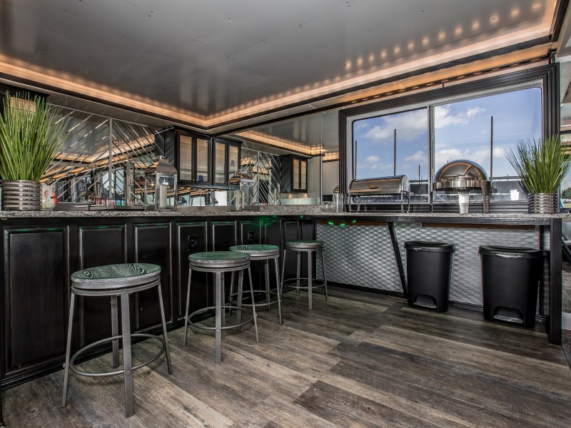 a room filled with furniture and a large window