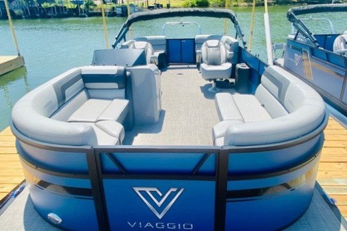 a blue boat sitting on top of a wooden table