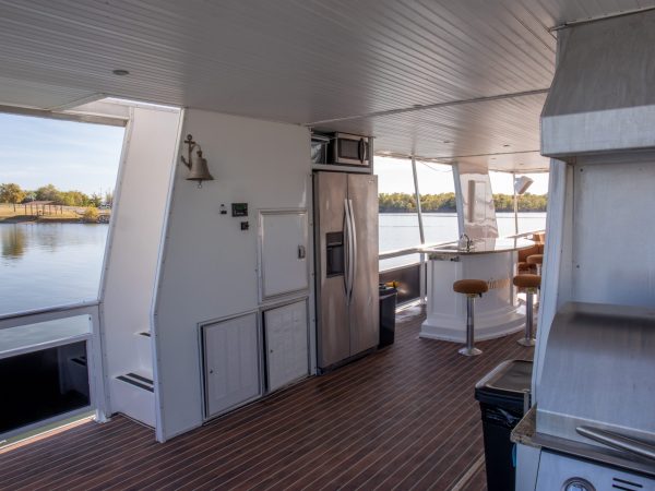 a kitchen with a stove top oven sitting inside of a building