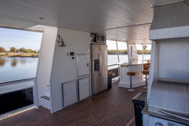 a kitchen with a stove top oven sitting inside of a building