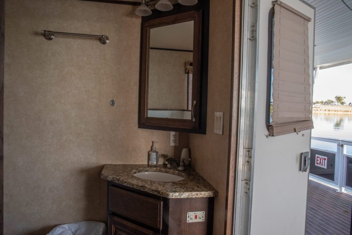 a room with a sink and a mirror