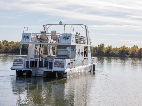 a boat is docked next to a body of water
