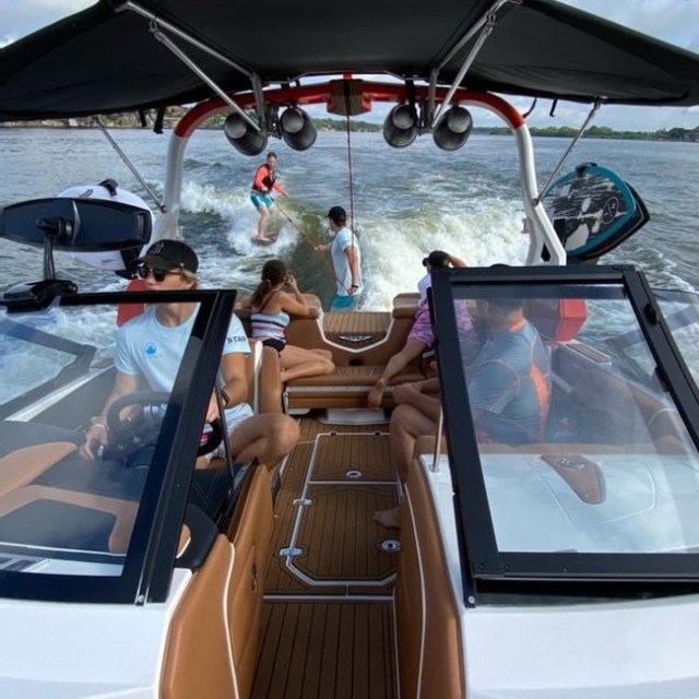a boat sitting on top of a car