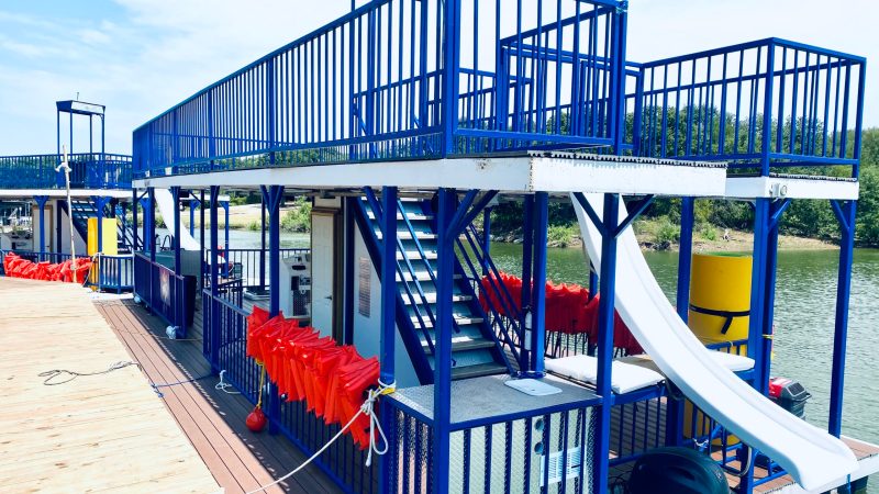 a chair sitting in front of a fence