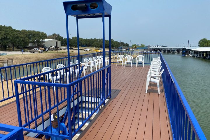 a close up of a pier next to a body of water
