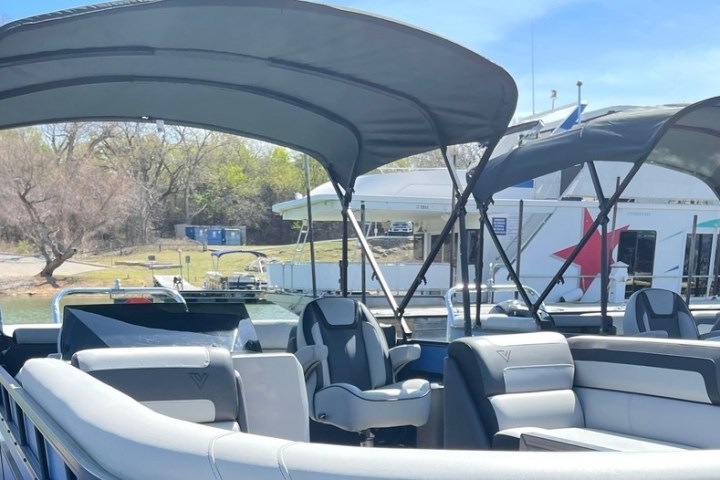 a boat sitting on top of a car